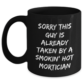 Funny Mortician Gifts, Sorry This Guy Is Already Taken By A Smokin' Hot Mom's Unique Father's Day Black Coffee Mug, Gifts from Family to Mortician - Main