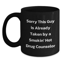 Funny Drug Counselor Gifts for Him, Unique Black Coffee Mug, 'Sorry This Guy Is Already Taken By A Smokin' Hot Drug Counselor' - Gifts from Men to Coworkers and Family - 11oz or 15oz Ceramic Mug - Main
