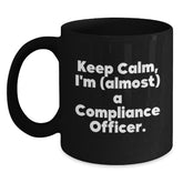 Funny Compliance Officer Gifts from Friends - Keep Calm, I'm (almost) A Compliance Officer. Inspired Black Coffee Mug for Compliance Officer - Main
