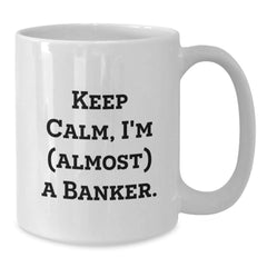 Funny Banker Gifts - Keep Calm I'm (almost) A Banker. White Coffee Mug for Birthday - Gifts from Friends, Coworkers, or Family - Additional