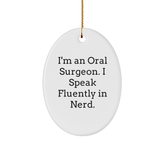 Funny Oral Surgeon Oval Ornament Gifts from Friends and Family, I'm An Oral Surgeon. I Speak Fluently In genius., White Oval Shaped Ornament for Christmas - Image 1