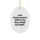 Gifts from Coworkers for Law Enforcement Officer - Law Enforcement Officer By Day. Ninja By Night. Oval Ornament, Funny Quote, Christmas Unique Gifts - Image 1