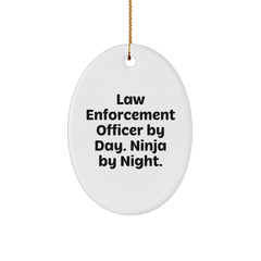 Gifts from Coworkers for Law Enforcement Officer - Law Enforcement Officer By Day. Ninja By Night. Oval Ornament, Funny Quote, Christmas Unique Gifts - Image 1
