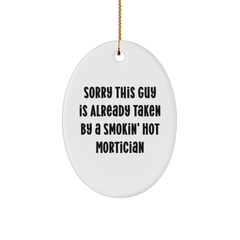 Funny Mortician Gift, Sorry This Guy Is Already Taken By A Smokin' Hot Mortician, Oval Ornament for Mortician, White, 3.25" tall, Ideal Gifts from Friends to Mortician, Unique Christmas Unique Gifts - Image 1