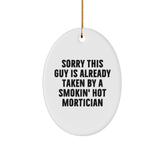 Mortician Gifts from Friends for Christmas, Sorry This Guy Is Already Taken By A Smokin' Hot Mortician Oval Ornament, Funny Quote - Image 1
