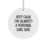 Funny Personal Care Aide Gifts, 'Keep Calm, I'm (almost) A Personal Care Aide!' Circle Ornament, White, Christmas Unique Gifts from Friends - Image 1