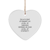 Flight Attendant Gifts, Funny Christmas Decor, Heart Ornament, 'I'm A Flight Attendant. My Level Of Sarcasm Depends On Your Level Of Stupidity.' - Image 1
