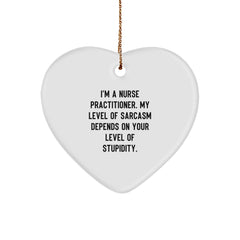 Funny Heart Ornament for Nurse Practitioner Gifts from Friends, Coworkers, or Family - 'I'm A Nurse Practitioner. My Level Of Sarcasm Depends On Your Level Of Stupidity.' - Image 1