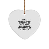 Funny Pediatrician Gifts from Friends for Christmas - Heart Ornament with 'I'm A Pediatrician. My Level Of Sarcasm Depends On Your Level Of Stupidity.' Quote - Image 1