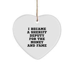 Funny Sheriff Deputy Gifts for Men from Friends - 'I Became A Sheriff Deputy For The Money And Fame' Heart Ornament for Christmas - Image 1