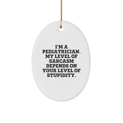 Funny Pediatrician Gifts from Friends - 'I'm A Pediatrician. My Level Of Sarcasm Depends On Your Level Of Stupidity.' Oval Ornament for Christmas - Image 1