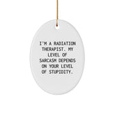 Funny Radiation Therapist Gifts from Friends and Family, 'I'm A Radiation Therapist. My Level Of Sarcasm Depends On Your Level Of Stupidity.' Oval Ornament for Men and Women, Christmas Unique Gift - Image 1