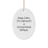 Funny Correctional Officer Gifts - 'Keep Calm, I'm (almost) A Correctional Officer.' Oval Ornament for Christmas - Gifts from Friends and Family - Image 1