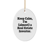 Funny Real Estate Investor Gifts - Keep Calm I'm (almost) A Real Estate Investor Oval Ornament, Gifts from Friends to Family for Christmas - Image 1