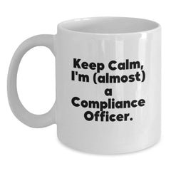 Funny Compliance Officer Gifts from Friends for Men White Coffee Mug - Keep Calm, I'm (almost) A Compliance Officer. - Main