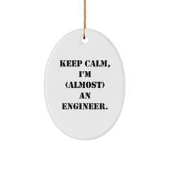Gifts from Friends for Engineer's Christmas - 'Keep Calm, I'm (almost) An Engineer.' Oval Ornament, White, 3.25" tall - Image 1