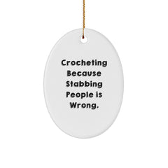 Funny Crocheting Gifts for Friends and Family, Oval Ornament with 'Crocheting Because Stabbing People Is Wrong.' Quote, Christmas Unique Presents - Image 1